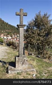 Stone cross, symbol of faith of the people of Gavieira village in the Peneda Mountain, North of Portugal