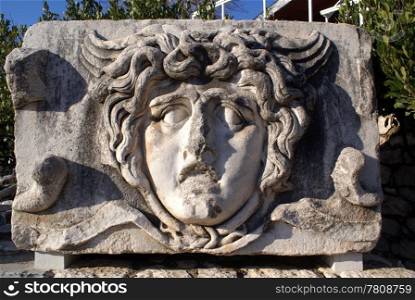 Stone face of man on ruins of Apollo temple, Didim