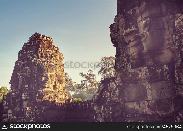 Stone faces of ancient Khmer culture temple of Bayon in Angkor area near Siem Reap, Cambodia