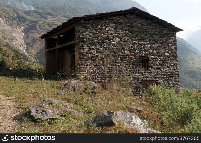 Stone farm house and mountain in Nepal