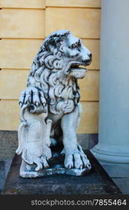 stone figure of a lion front of drottningholm