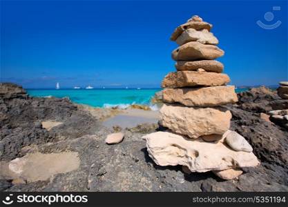 Stone figures on beach shore of Illetes beach in Formentera Mediterranean Balearic Islands