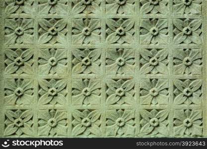 Stone floral ornament on the wall as background