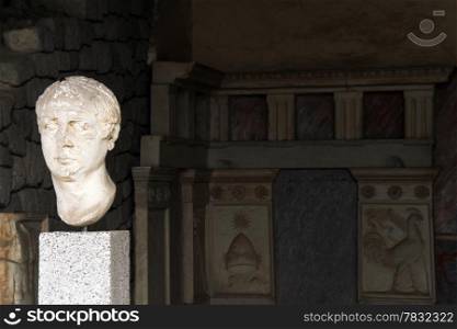 Stone head of ancient man and room of villa, Bergama