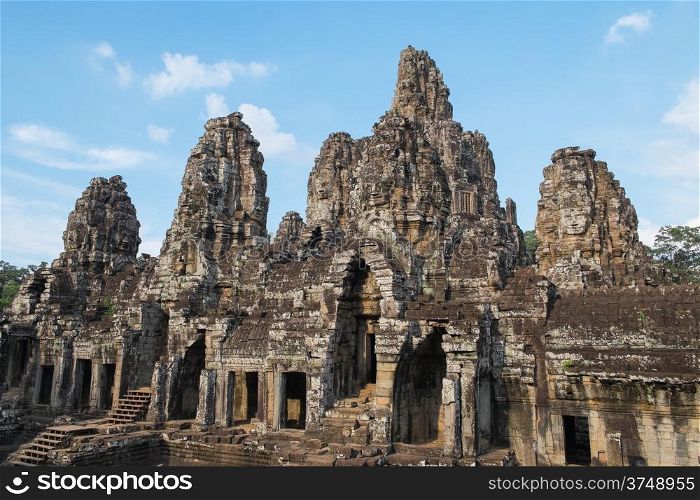 Stone heads at ancient Bayon Temple in Angkor Wat, Cambodia