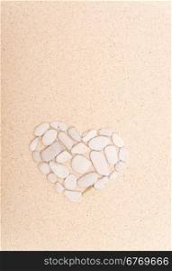 stone heart on a sand