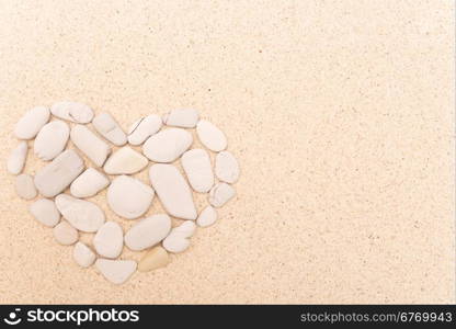 stone heart on a sand