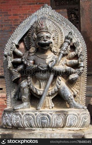 Stone hindu god near temple in Bhaktapur, Nepal