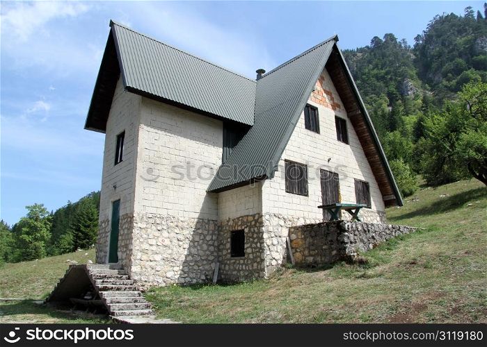 Stone house on the slope of mount in Montenegro