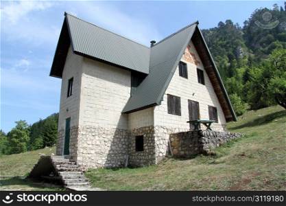 Stone house on the slope of mount in Montenegro