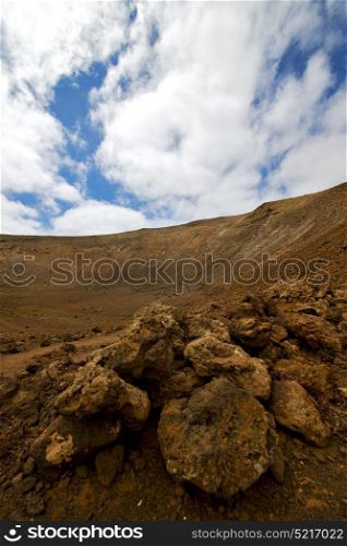stone in los volcanes lanzarote spain volcanic timanfaya rock sky hill and summer