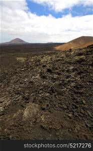 stone in los volcanes lanzarote spain volcanic timanfaya rock sky hill and summer
