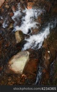 stone in rapid water. nature