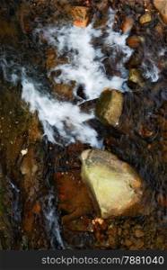 stone in rapid water. nature