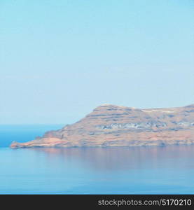 stone in the coastline and light ocean white sky