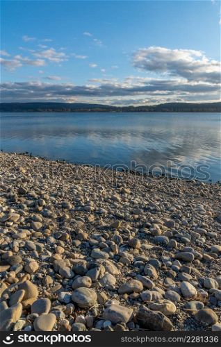 stone landscape and water reflection, blue sky