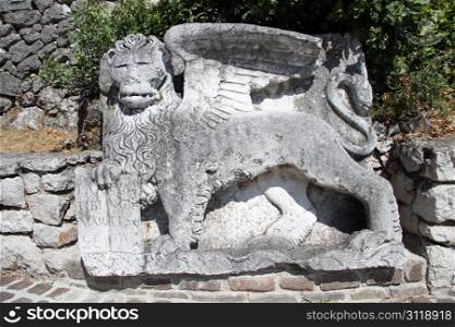 Stone lion near the road to Trsat csastle in Rijeka, Croatia