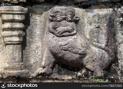 Stone lion on the wall of old royal palace in Polonnaruva, Sri Lanka