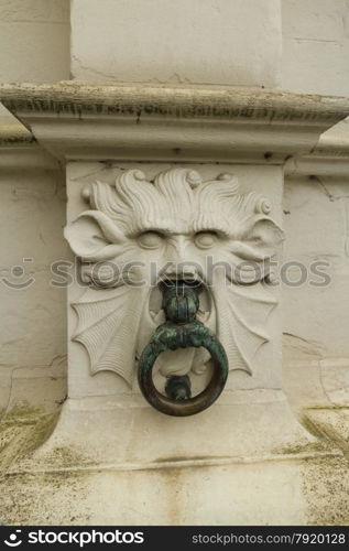 Stone lion?s head with ring in mouth. Aaron Civil Registry, Burg Square, Bruges, West Flanders, Belgium, Europe.