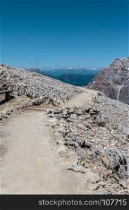 Stone Path among Barren Mountains in Italian Dolomites Alps in Summer Time. Stone Path among Barren Mountains in Italian Dolomites Alps in S