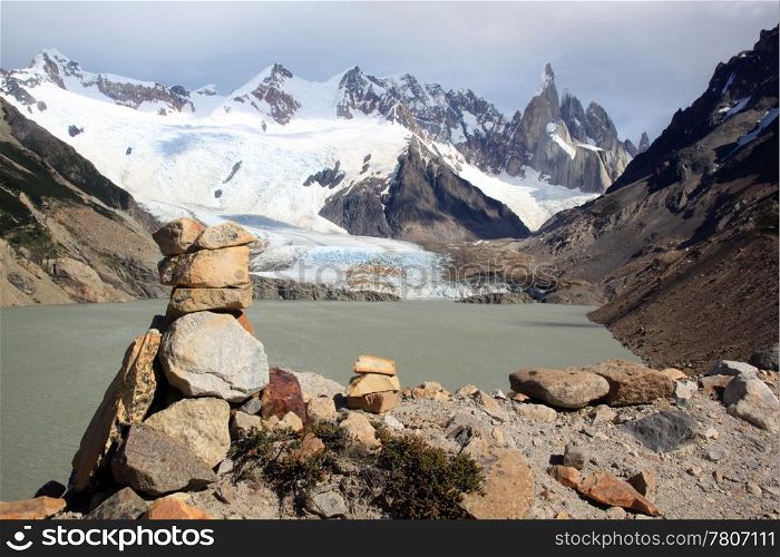 Stone piramid and lake in mountain near El Chalten, Argentina