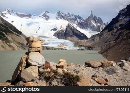 Stone piramid and lake in mountain near El Chalten, Argentina