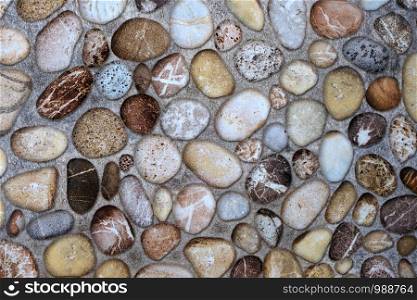 Stone rock surface textured on cement wall background, detail close up, nature background