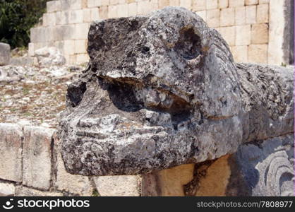 Stone sculpture on the corner of Juego de pelota in Chichen Itza, Mexico