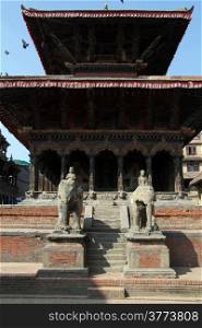 Stone sculptures and wooden temple in Patan, Nepal