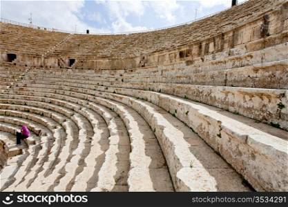 stone seats in antique Large South Theatre , Jerash in Jordan