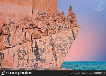 Stone ship shaped Monument to the Discoveries hailing Portugals famous navigator and history, Portugal at sunset