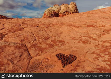 Stone stacked in shape of heart in the beautiful sandstone mountains. Valentines day concept.