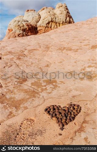Stone stacked in shape of heart in the beautiful sandstone mountains. Valentines day concept.