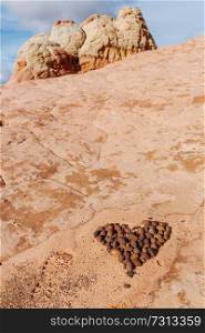 Stone stacked in shape of heart in the beautiful sandstone mountains. Valentines day concept.
