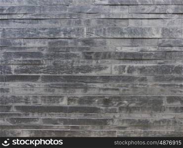 Stone structure. Stone wall with gray-brown structure