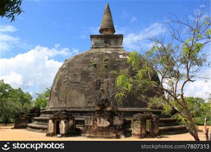 Stone stupa and trees in Polonnaruva, Sri Lanka