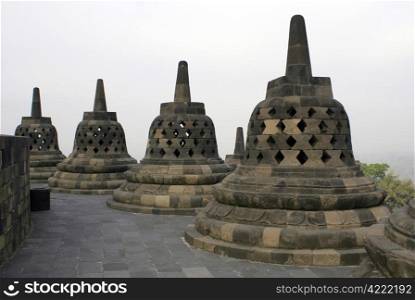 Stone stupas on the temple Borobudur, Java, Indonesia