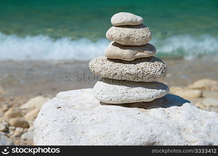 Stone tower with blue sky and sea background