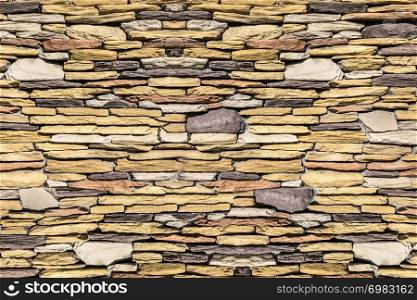 Stone wall background at laying of thin horizontal brick modern style design decoration interior and exterior.
