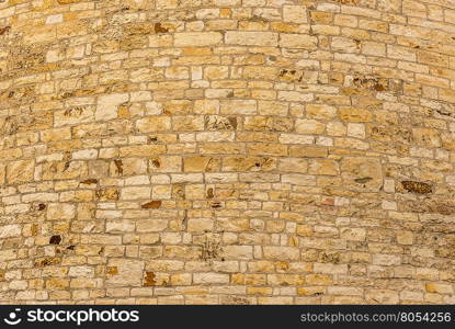 Stone wall background Texture image composed from an aged stone wall, sharp details and interesting curves.