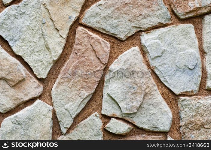 Stone wall background with odd shapes and sizes
