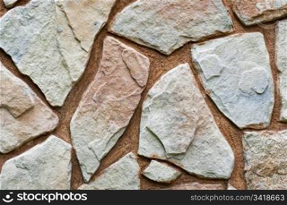 Stone wall background with odd shapes and sizes