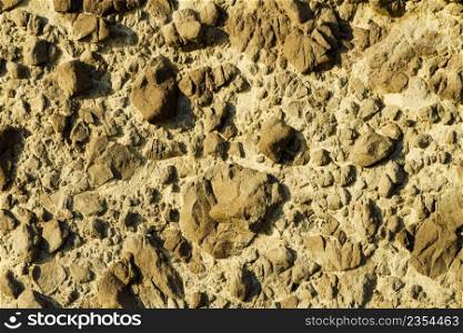 Stone wall. Brown background texture. Background of stone wall