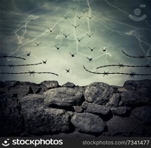 Stone wall fence of a prison with barbed metallic wire on top transform into flying birds over the lightning sky background. Freedom and success concept.