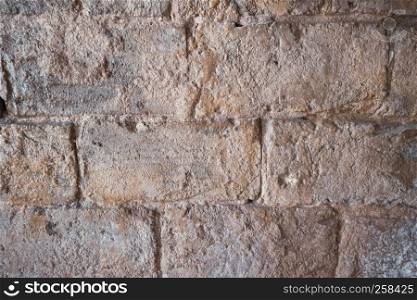 Stone wall of old limestone stones. Abstract texture background