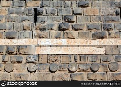 Stone wall of roman theater in Bosra, Syria