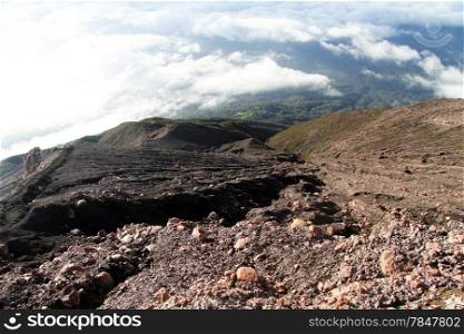Stones and forest on the slope of volcano Kerinci in Indonesia