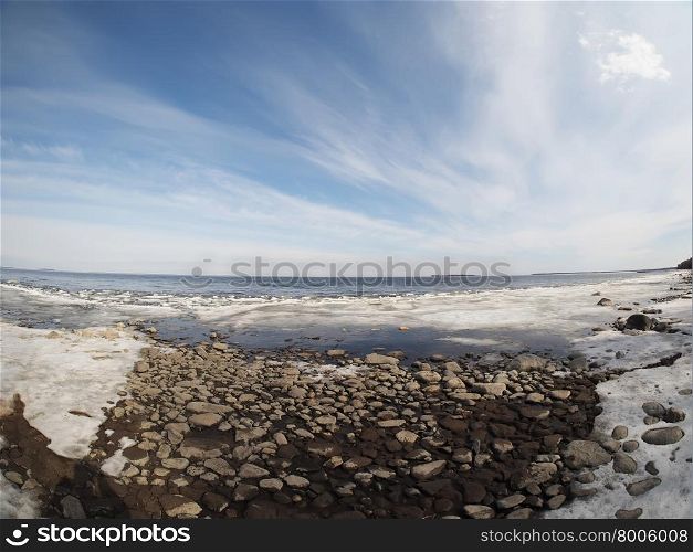stones and ice on the lake