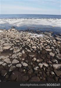 stones and ice on the lake