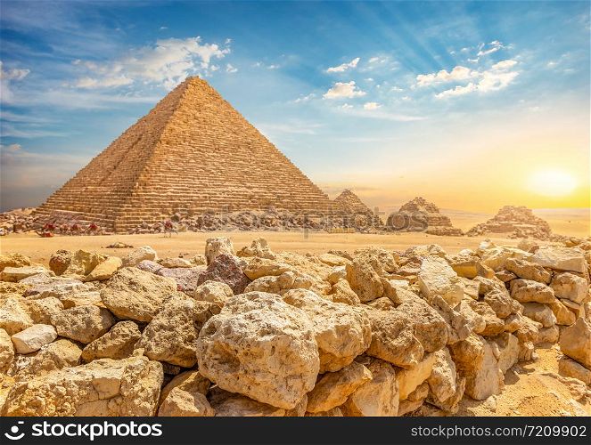 Stones around Great Pyramids in Giza at sunset, Egypt. Stones around Pyramids